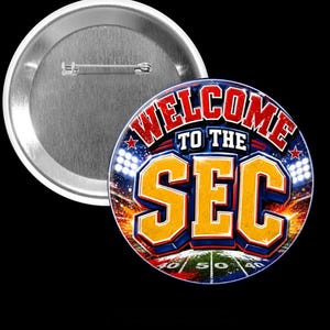 May include: A round button with the text "WELCOME TO THE SEC" in red and yellow, with a football field design. The button has a metal pin back and a white border.