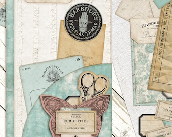 May include: A vintage-style folder notebook with a light blue pocket, adorned with ephemera like a butterfly-shaped label, scissors, and a Barbour's Irish Flax Thread label. The notebook includes the text "Relics, Curiosities, Autographs."
