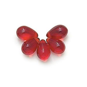 May include: Five red glass beads in a teardrop shape.