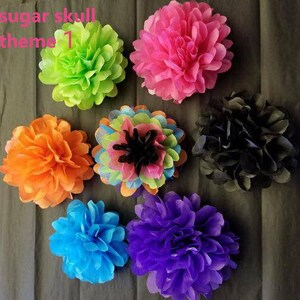 May include: A collection of colorful paper flowers in various shades, including green, pink, orange, blue, and purple. The flowers are arranged on a dark background. Text in the upper left corner reads "sugar skull theme 1".
