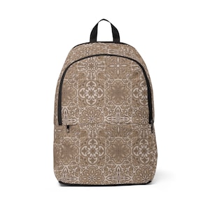 May include: A backpack with a repeating floral tile pattern in shades of brown and beige. The backpack has a black zipper, handle, and trim. The design is reminiscent of vintage or antique tilework.