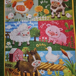 May include: A colorful farm-themed fabric panel featuring cartoon illustrations of a chicken, cow, sheep, pig, horse, duck, and frog. Each animal is accompanied by its respective sound in text. The panel has a green border.