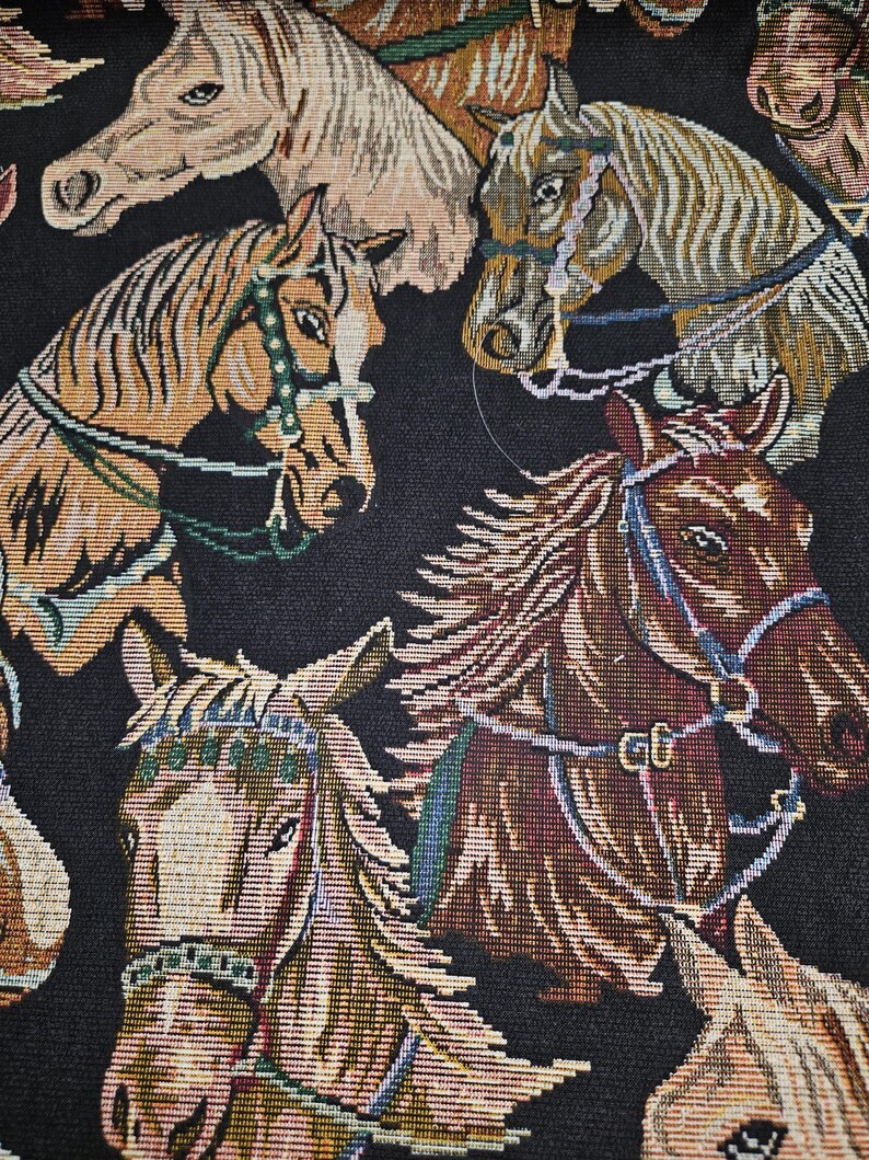 May include: Close-up of a fabric with a repeating pattern of horse heads. The horses are depicted in various shades of brown, tan, and cream, with detailed bridles and manes. The background is black, creating a striking contrast.