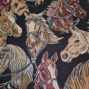 May include: A tapestry featuring a repeating pattern of horse heads in various shades of brown, tan, and cream, set against a black background. The horses are adorned with bridles and harnesses, creating a detailed and textured design.
