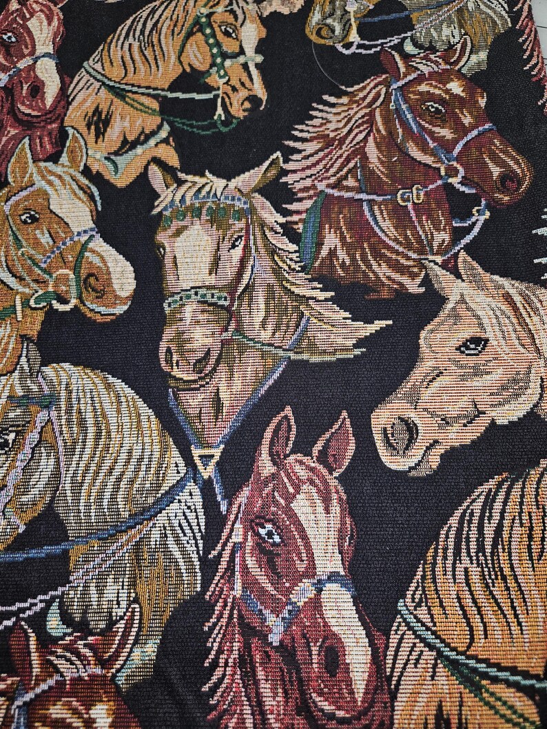 May include: A tapestry featuring a repeating pattern of horse heads in various shades of brown, tan, and cream, set against a black background. The horses are adorned with bridles and harnesses, creating a detailed and textured design.