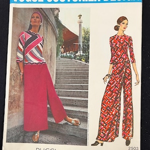 May include: A vintage Vogue Couturier Design sewing pattern featuring a geometric print dress and pants design by Pucci. The pattern number is 2503.