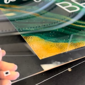 We Print on Acrylic, Office Signs, Clear Invites, Photographs.