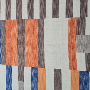 May include: Abstract textile pattern featuring vertical and horizontal rectangular shapes in shades of orange, brown, blue, and gray on a light background. The design has a hand-drawn, textured appearance.