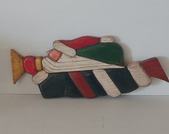 Hand carved Santa Claus made by artist Bob Smith. This delightful hand carved and painted wooden Santa in a Folk Art Style.