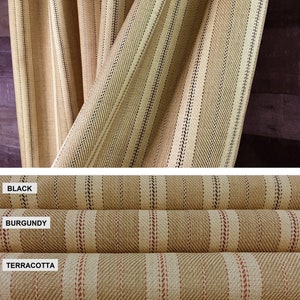 May include: Close-up of three fabric samples with a striped pattern. The top sample is black and white, the middle sample is burgundy and white, and the bottom sample is terracotta and white.