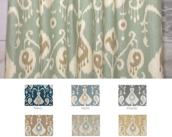 May include: A close-up of a fabric swatch with a teal and brown ikat pattern. The fabric is available in ten different colours: Navy, Yacht, Pewter, Umber, Driftwood, Barley, Teal, Sage, Charcoal, and Ivory.