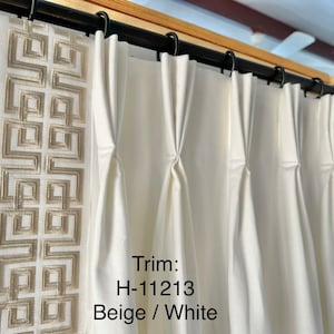 Pair of fully lined pinch pleat or euro pleat curtains/drapes in white 7 oz. Cotton duck with beige border tape on leading edge - 2 panels