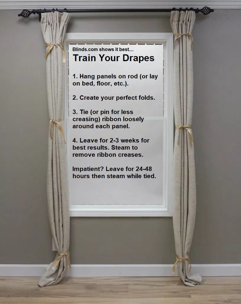 May include: A window with two beige curtains hanging on a black curtain rod. The window has a white frame and a white sill. The window is decorated with a sign that reads "Train Your Drapes" and instructions on how to train drapes.