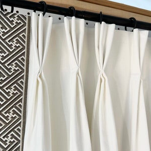 Pair of fully lined pinch pleat or euro pleat curtains/drapes in white 7 oz. Cotton duck with taupe border tape on leading edge - 2 panels