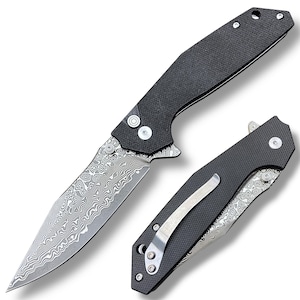 May include: A folding pocket knife with a patterned blade and a textured black handle. The blade has a unique, swirling design. The knife is shown open and closed, with a silver pocket clip on the closed knife.