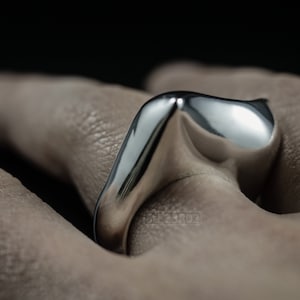 Contemporary Massive Modern Ring in Sterling Silver with Curves and High Shine, Cushion Like Shape. On Finger.