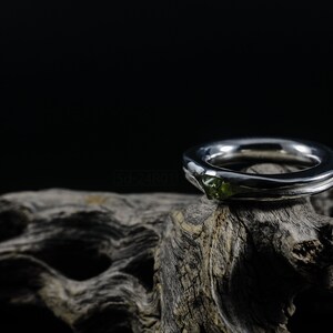 Bold Irregular Unisex Ring in Sterling Silver with Green Natural Peridot Nugget, Thick Forged Chunky Jewelry, Hammered Unique Ring. On Dry Cactus Wood.