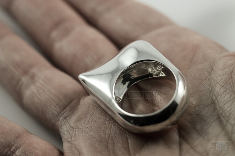 Contemporary Massive Modern Ring in Sterling Silver with Curves and High Shine, Cushion Like Shape. On Palm.