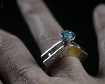 Contemporary ring with reticulated sterling silver and keum boo 24k gold foil and blue topaz stone, double-sided