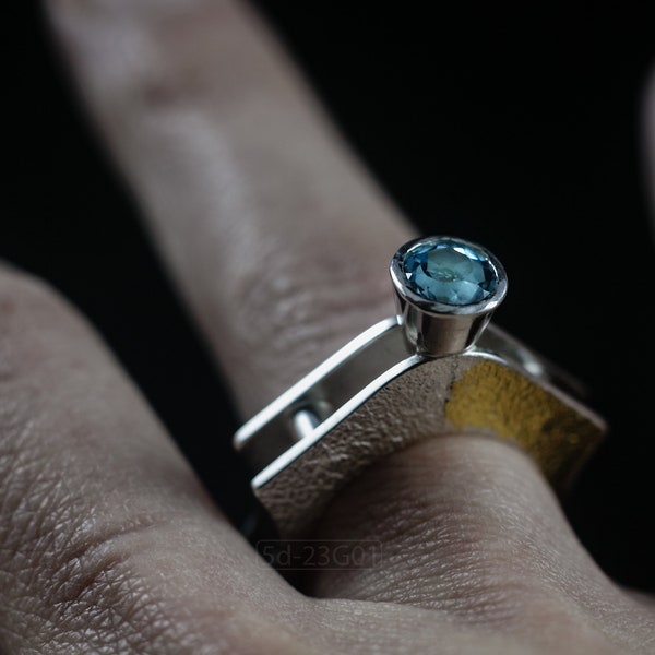 Contemporary ring with reticulated sterling silver and keum boo 24k gold foil and blue topaz stone, double-sided