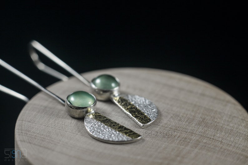 Reticulated Silver Earrings with 24k Keum-Boo Gold Foil and Prehnite Cabochons, Organic and Contemporary. Reticulated Half Oval Shape with a Stripe of Gold Leaf and Long Ear Wires. On wooden box
