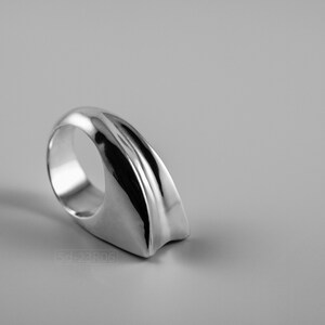 Geometric Ring, Contemporary Design, Massive, Bold and Unisex, with High Shine Finish. On white background.