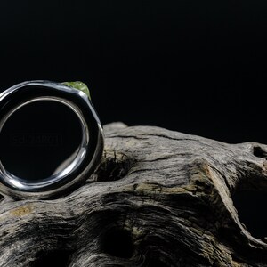 Bold Irregular Unisex Ring in Sterling Silver with Green Natural Peridot Nugget, Thick Forged Chunky Jewelry, Hammered Unique Ring. On Dry Cactus Wood.