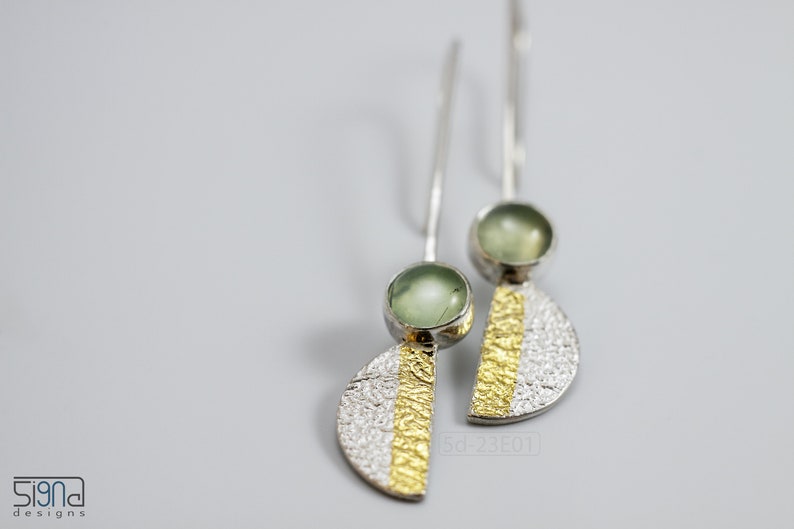 Reticulated Silver Earrings with 24k Keum-Boo Gold Foil and Prehnite Cabochons, Organic and Contemporary. Reticulated Half Oval Shape with a Stripe of Gold Leaf and Long Ear Wires. on white background.