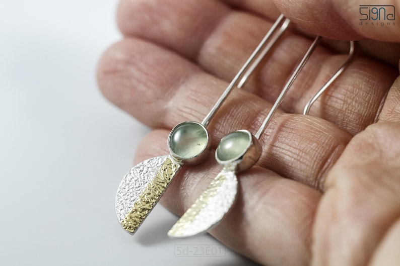 Reticulated Silver Earrings with 24k Keum-Boo Gold Foil and Prehnite Cabochons, Organic and Contemporary. Reticulated Half Oval Shape with a Stripe of Gold Leaf and Long Ear Wires. In hand.