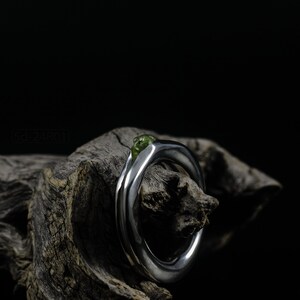 Bold Irregular Unisex Ring in Sterling Silver with Green Natural Peridot Nugget, Thick Forged Chunky Jewelry, Hammered Unique Ring. On Dry Cactus Wood.