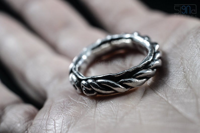 Primitive, raw, organic unisex sterling silver ring with twisted design and patina. In hand