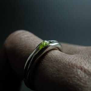 Bold Irregular Unisex Ring in Sterling Silver with Green Natural Peridot Nugget, Thick Forged Chunky Jewelry, Hammered Unique Ring. On Finger.