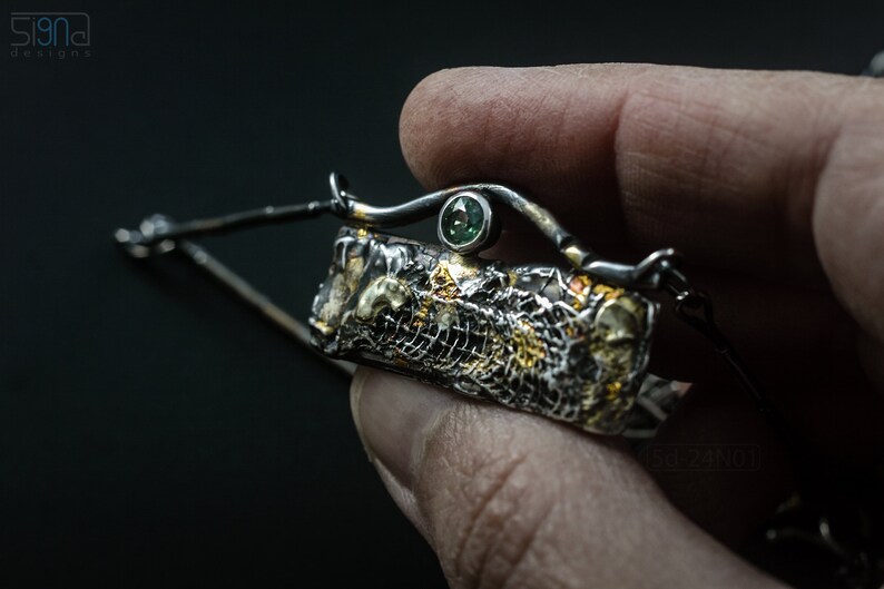 Mixed Metal Organic Necklace with Greenish Blue Sapphire and Topaz, Dark Texture, Statement Edgy Asymmetrical Chain, Silver and Gold Accents. In Hand. Detail.
