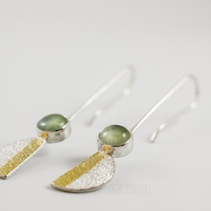 Reticulated Silver Earrings with 24k Keum-Boo Gold Foil and Prehnite Cabochons, Organic and Contemporary. Reticulated Half Oval Shape with a Stripe of Gold Leaf and Long Ear Wires. On white background.