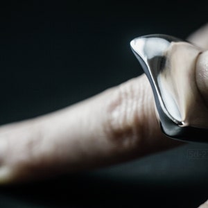 Contemporary Massive Modern Ring in Sterling Silver with Curves and High Shine, Cushion Like Shape. On Finger.