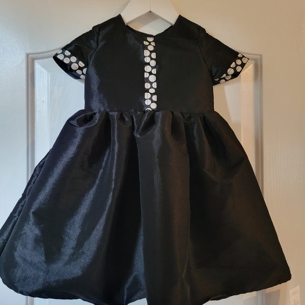 Shiny black taffeta dress only available in the sizes listed