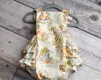 Embroidered optional Initial Vintage Winnie the Pooh romper girl. Fabric currently out of stock. I have the same fabric but slightly muted.