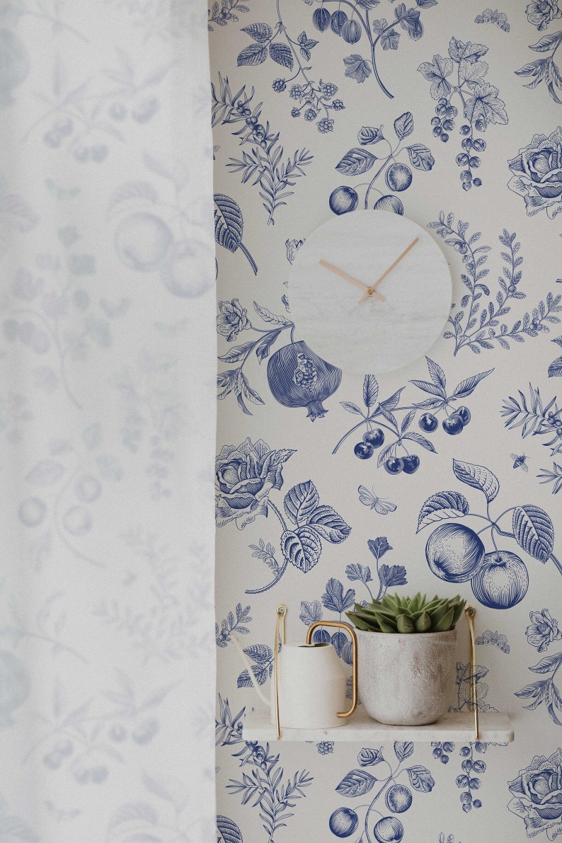 May include: A white shelf with a blue and white floral wallpaper featuring a clock, a watering can, and a potted succulent plant. The wallpaper has a vintage botanical illustration style.