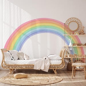 May include: A bright children's bedroom with a large rainbow mural. The room features a rattan daybed with white bedding, a round jute rug, and a small rattan chair. A decorative mirror and shelves with toys add to the playful decor.
