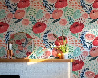 May include: A white brick fireplace with a black firebox and a wood-burning stove. The fireplace is decorated with a floral wallpaper featuring red, pink, and blue flowers and leaves.