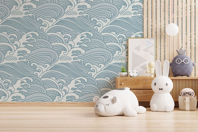 May include: A light blue and white wave patterned wallpaper with a wooden shelf and a variety of stuffed animals, including a white polar bear, a white rabbit, and a gray pineapple with glasses.