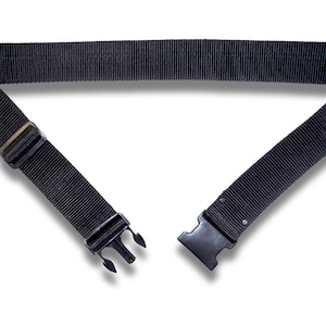May include: A black nylon belt with a plastic buckle closure. The belt is approximately 1.5 inches wide and features a ribbed texture. The buckle has a three-prong design for secure fastening. The belt is designed for waist sizes up to 40 inches.