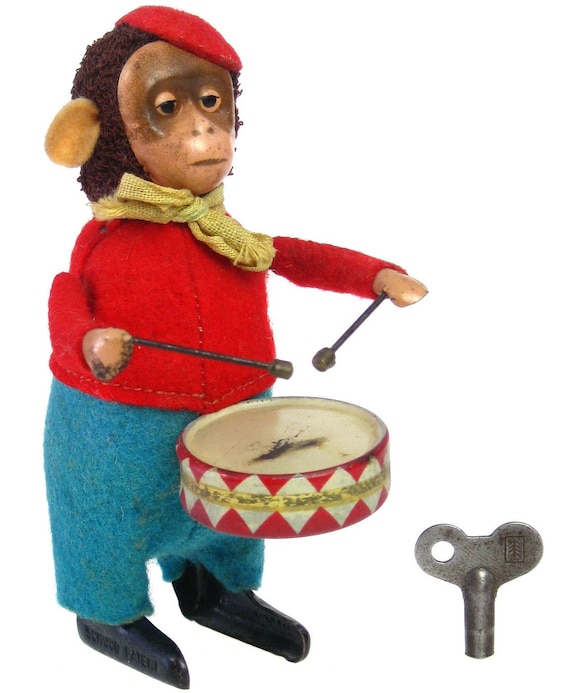 monkey toy playing drums