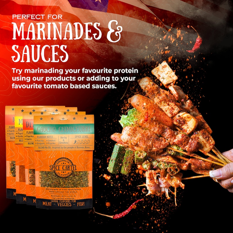 May include: Four small spice packets with different flavors, including "Gaucho Chimichurri" and "M de Flavor". The packets are on a black background with a red, white, and blue flag in the background. The packets are labeled with the text "Spice Cartel" and "Global Flavors for Meat - Veggies - Fish".