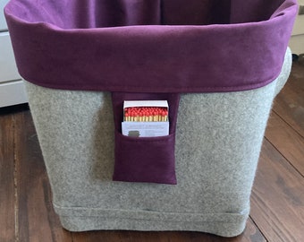 Basket for firewood made of grey-brown wool felt with inner pocket, on wheels, shape: Round on square