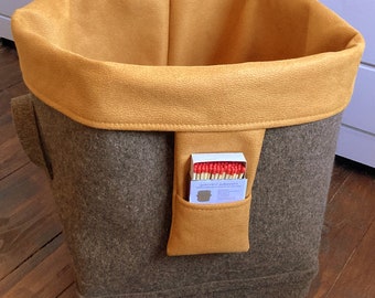 Basket for firewood made of brown wool felt with inner pocket, on wheels, shape: round on square