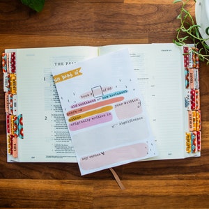 May include: A printable Bible study worksheet with the text "The Book of" and a blank space to fill in the name of a book of the Bible. The worksheet includes sections for the book number, Old or New Testament, genre, author, year written, originally written in, and significance.