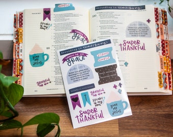 May include: A sheet of stickers with a Thanksgiving theme. The stickers feature phrases like "Thankful for His Grace", "Super Thankful", "Give Me Jesus", and "Grateful for You".