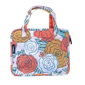 May include: A floral print tote bag with a top handle. The bag features a pattern of large orange, white, and yellow roses with green leaves on a light pink background. The bag has a zipper closure and a small pocket. The text "Keep it G" is visible.