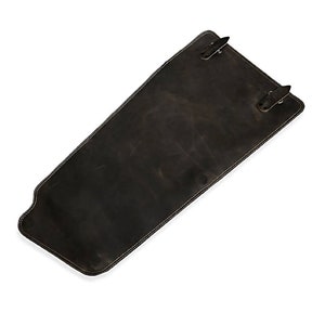 May include: A dark brown leather motorcycle gas tank bag with two buckles.